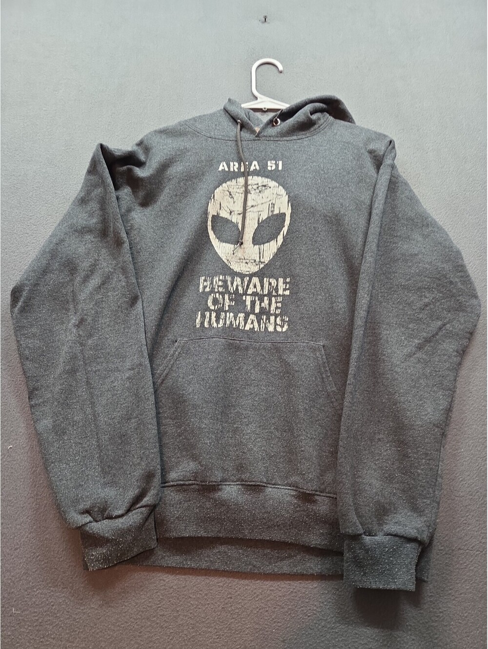 men's gray long-sleeved hooded sweatshirt by Jerzees size M